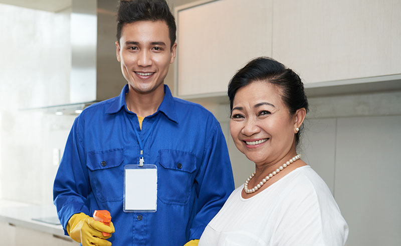 an image of a happy client taking a picture with his cleaner